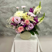 Loving Wishes ceramic pot flower arrangement with pink roses, orchids, lisianthus and seasonal flowers by Oopsy Daisy Flowers Melbourne