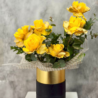 Mellow Yellow 6 yellow glitter roses in a black and gold hatbox