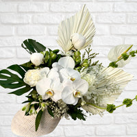 White orchid flower arrangement in angled white vase – Oopsy Daisy Flowers