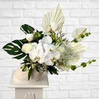 White orchid flower arrangement in angled white vase – Oopsy Daisy Flowers