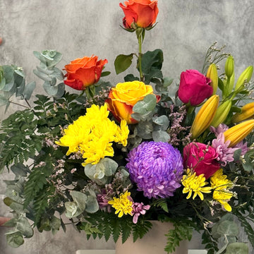 Bright and Cheerful Chrysanthemums and Roses in a Grey Vase