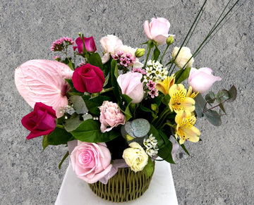 red and pink roses in vase