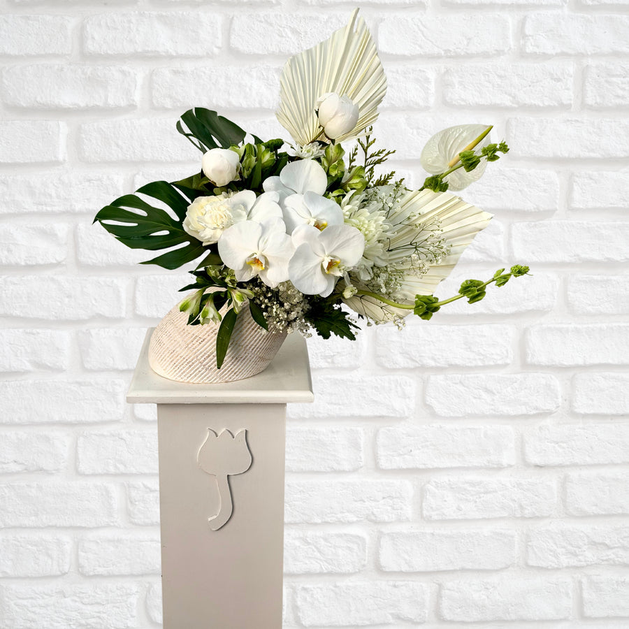 White orchid flower arrangement in angled white vase – Oopsy Daisy Flowers