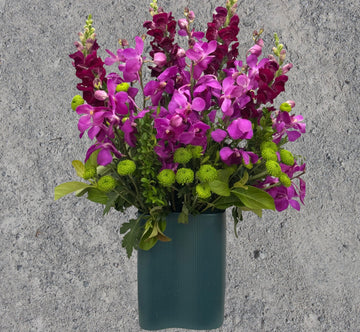 Purple Flowers in a Tall Vase