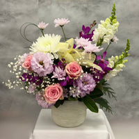 Loving Wishes ceramic pot flower arrangement with pink roses, orchids, lisianthus and seasonal flowers by Oopsy Daisy Flowers Melbourne