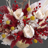 red and white preserved flower arrangement