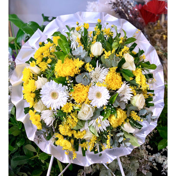 yellow and white round asian chinese funeral wreath